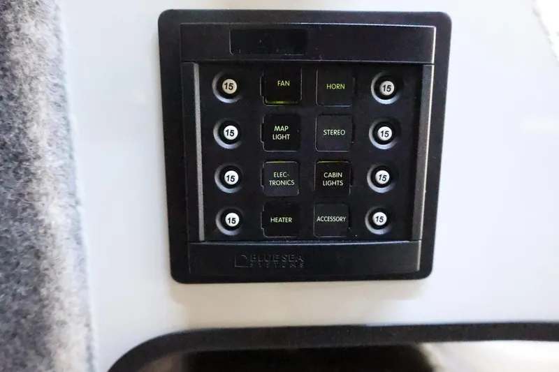 Slide: The Image of Control panel of 2026 Thunder Jet 28 Pilot boat with labeled switches and fuses. - 72