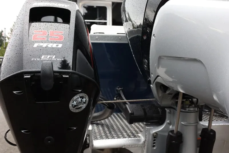 Slide: The Image of 2026 Thunder Jet 28 Pilot boat with EFI FourStroke 25 Pro engine, close-up view. - 9