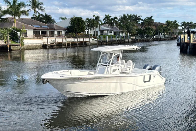 The Image of 2021 Sea Fox 268 Commander boat cruising on a calm waterway with palm trees. - 0