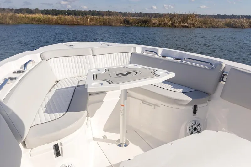 Slide: The Image of Manufacturer Provided Image: 2021 Sea Fox 268 Commander boat interior with seating and table on calm water. - 12