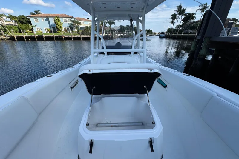 Slide: The Image of 2021 Sea Fox 268 Commander boat interior with open storage compartment on a calm waterway. - 16