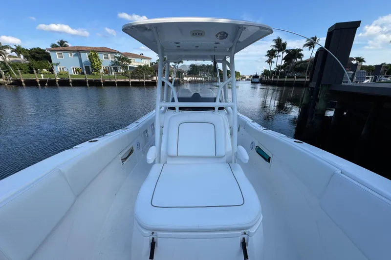 Slide: The Image of 2021 Sea Fox 268 Commander boat on a calm waterway, clear sky background. - 17