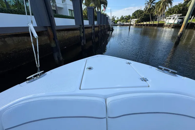 Slide: The Image of Bow view of 2021 Sea Fox 268 Commander in a serene canal setting. - 20
