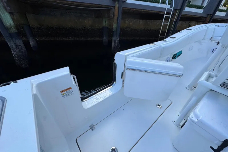 Slide: The Image of 2021 Sea Fox 268 Commander boat with open side door near dock. - 4