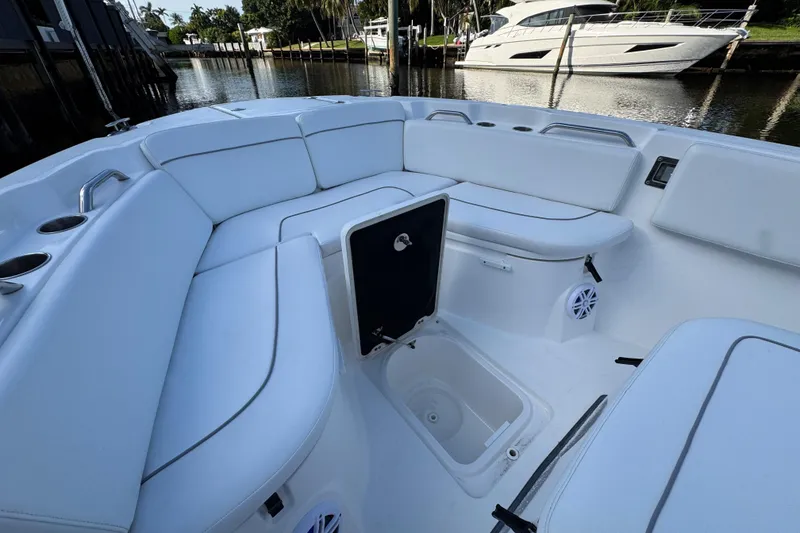 Slide: The Image of 2021 Sea Fox 268 Commander boat interior with white seating and storage compartment. - 9