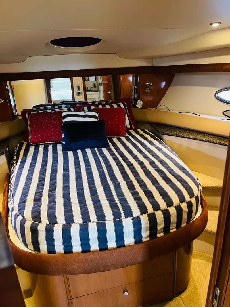 Slide: The Image of Interior of 2006 Meridian 408 Motoryacht with striped bed. - 12