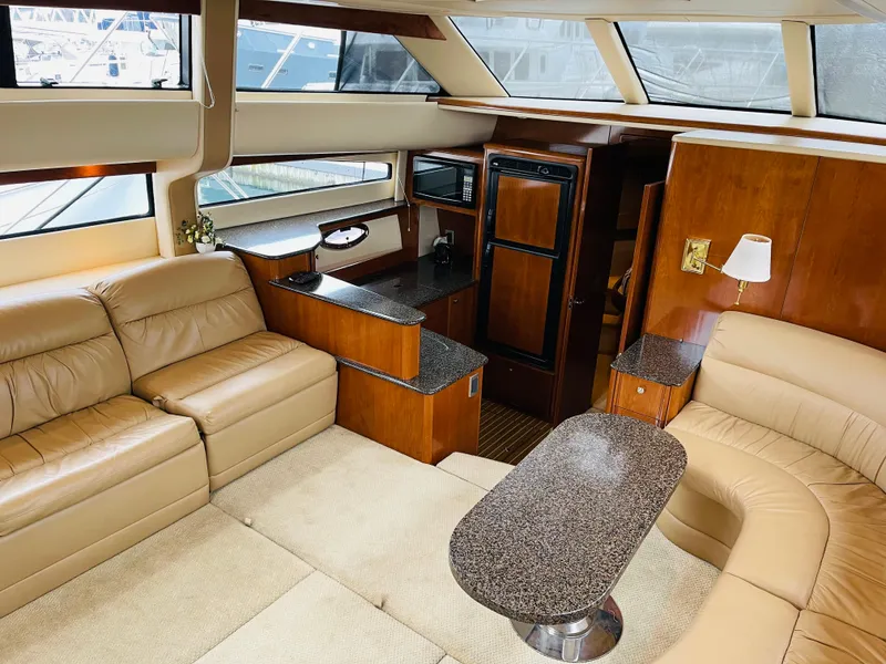 Slide: The Image of Interior of a 2006 Meridian 408 Motoryacht with leather sofas and wood furnishings. - 18