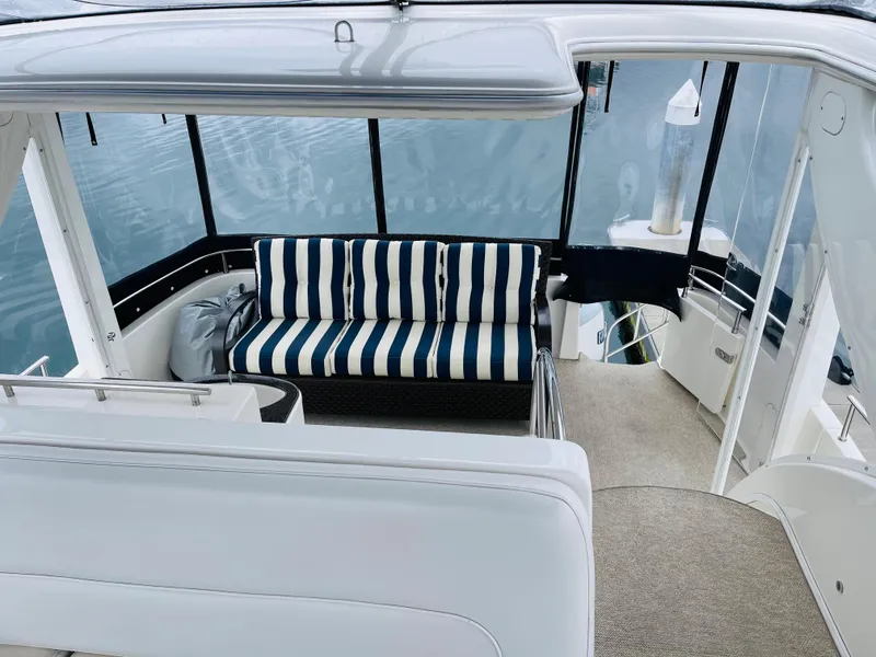 Slide: The Image of Interior of a 2006 Meridian 408 Motoryacht with striped sofa. - 21