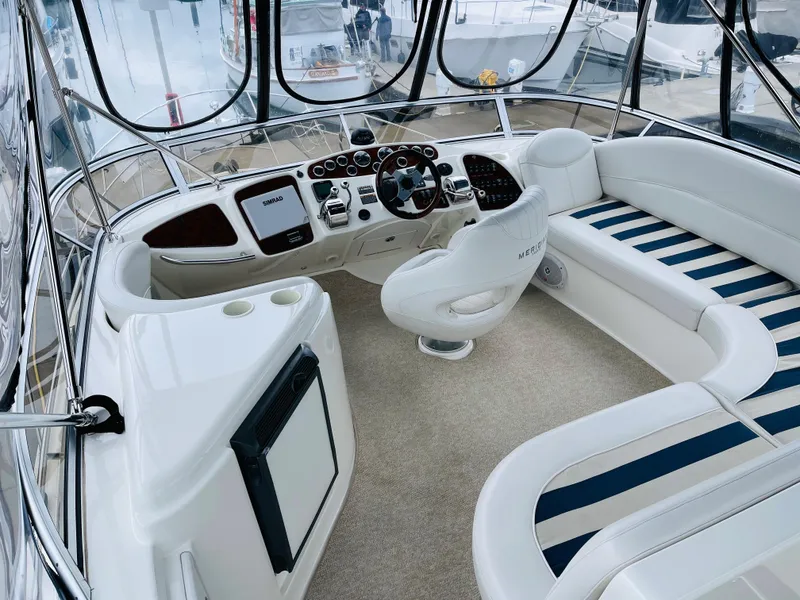 Slide: The Image of Interior of 2006 Meridian 408 Motoryacht with helm and seating area. - 23