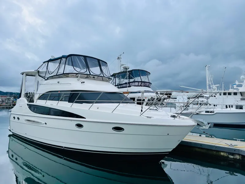 Slide: The Image of 2006 Meridian 408 Motoryacht docked, cloudy sky. - 24