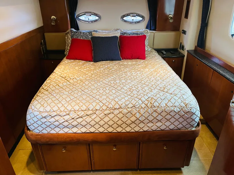 Slide: The Image of Luxurious bedroom in a 2006 Meridian 408 Motoryacht. - 5