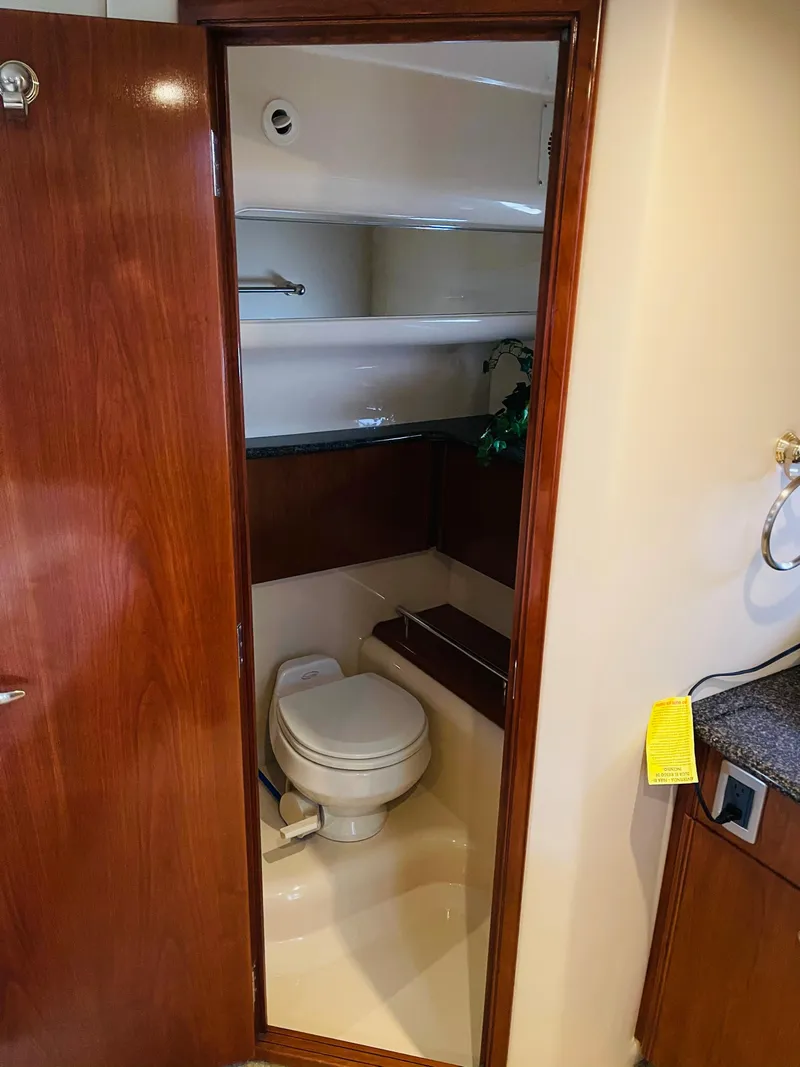 Slide: The Image of Bathroom in 2006 Meridian 408 Motoryacht with toilet and shelves. - 7