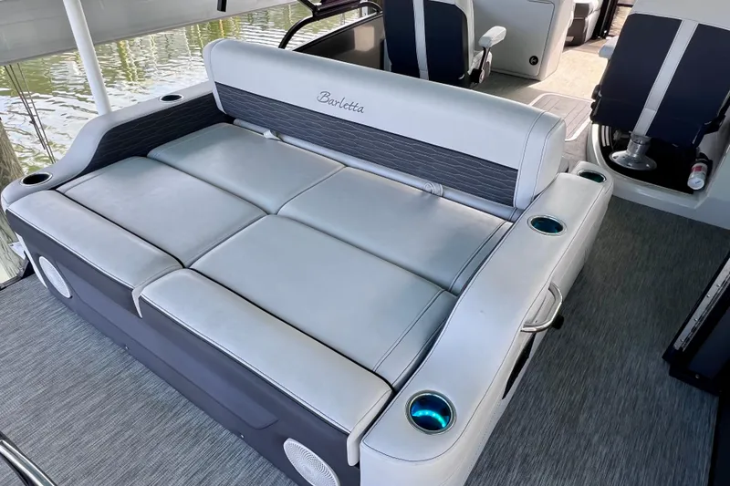 Slide: The Image of 2023 Barletta Corsa 23UC boat interior with luxurious seating and cup holders. - 13