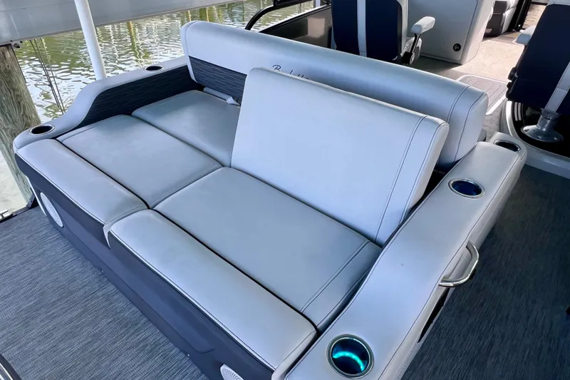 Slide: The Image of 2023 Barletta Corsa 23UC boat interior with luxurious seating and cup holders. - 16