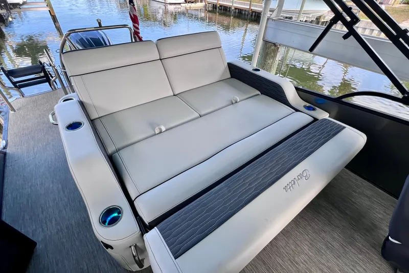 Slide: The Image of 2023 Barletta Corsa 23UC boat interior with luxurious seating and cup holders. - 18