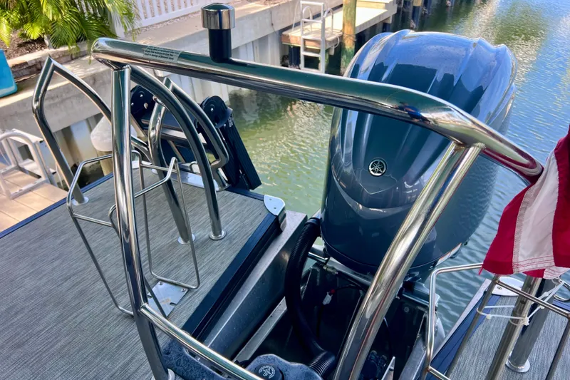 Slide: The Image of 2023 Barletta Corsa 23UC boat with Yamaha outboard motor and stainless steel railing. - 22