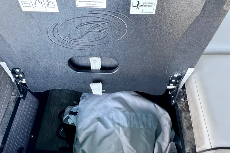 Slide: The Image of 2023 Barletta Corsa 23UC storage compartment with Yamaha cover inside. - 25