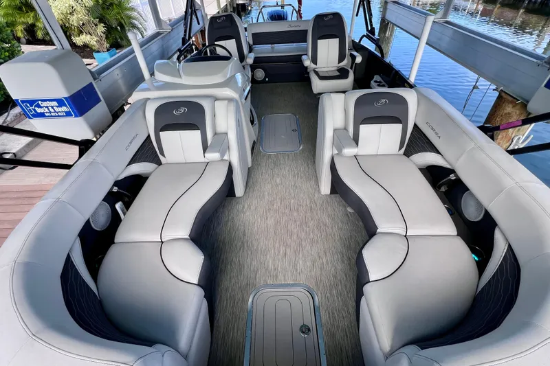 Slide: The Image of 2023 Barletta Corsa 23UC pontoon boat interior with luxurious seating and modern design. - 29