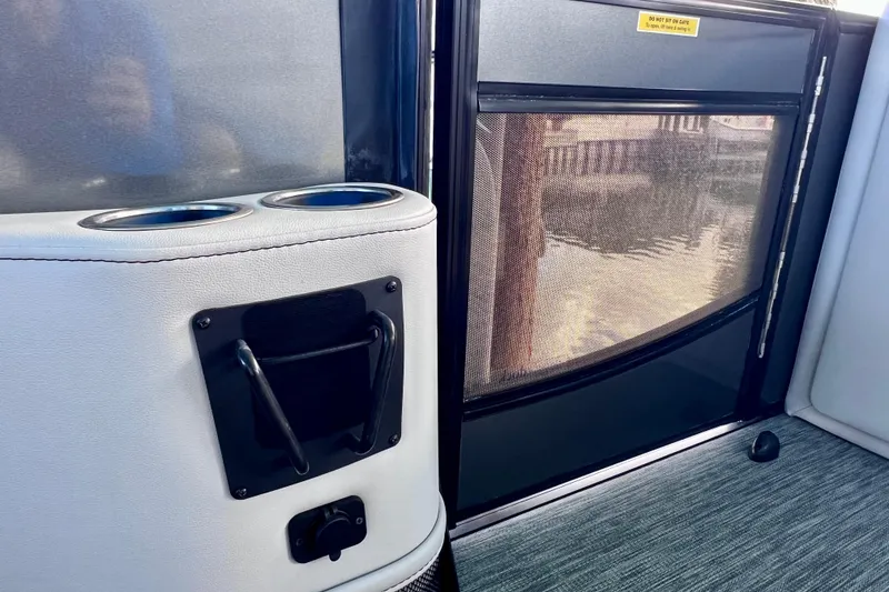 Slide: The Image of 2023 Barletta Corsa 23UC interior with cup holders and mesh gate. - 32