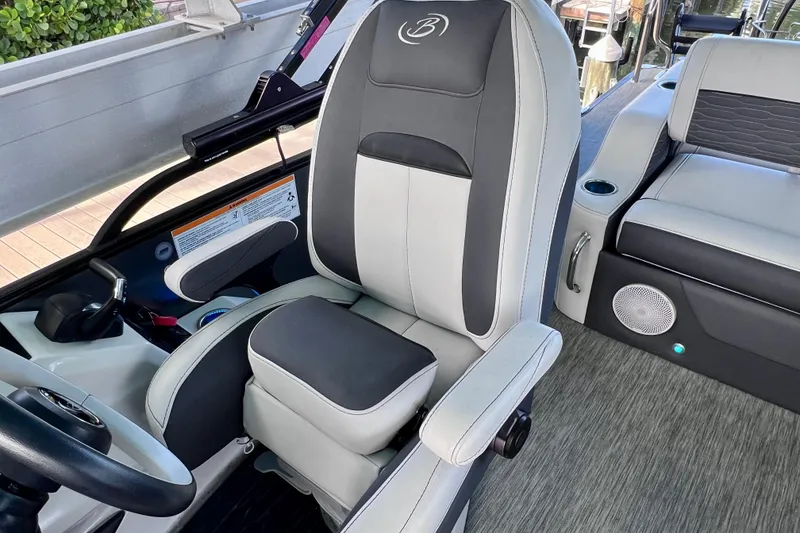 Slide: The Image of Captain's chair in 2023 Barletta Corsa 23UC boat, featuring sleek design and comfortable seating. - 34