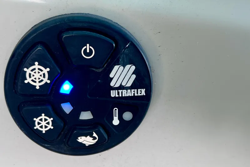 Slide: The Image of Ultraflex control panel on 2023 Barletta Corsa 23UC boat, featuring various function icons. - 42