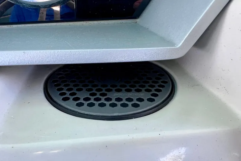 Slide: The Image of Close-up of a speaker grill on a 2023 Barletta Corsa 23UC boat. - 45