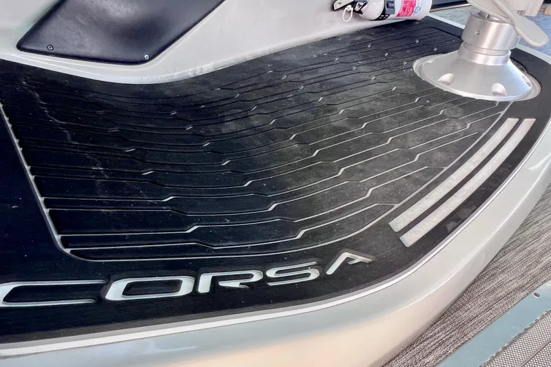 Slide: The Image of 2023 Barletta Corsa 23UC boat deck with logo and textured surface. - 46