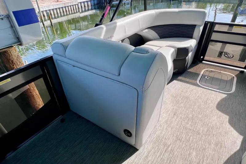 Slide: The Image of 2023 Barletta Corsa 23UC pontoon boat interior with plush seating and modern design. - 55