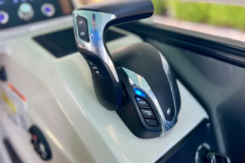 Slide: The Image of Close-up of 2023 Barletta Corsa 23UC boat throttle control. - 62