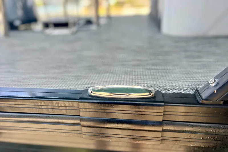 Slide: The Image of 2023 Barletta Corsa 23UC boat deck detail with sleek metal finish. - 64