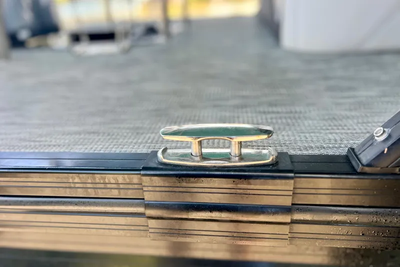 Slide: The Image of 2023 Barletta Corsa 23UC boat cleat on textured deck surface. - 65