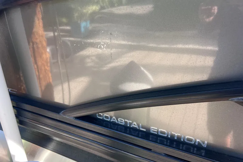 Slide: The Image of 2023 Barletta Corsa 23UC Coastal Edition detail with reflective surface. - 66