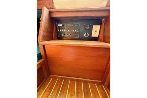 Slide: The Image of 2019 Com-Pac 23/IV sailboat interior control panel with wooden finish. - 10