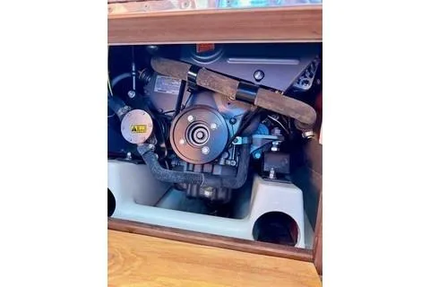 Slide: The Image of 2019 Com-Pac 23/IV sailboat engine compartment, showcasing mechanical components. - 11