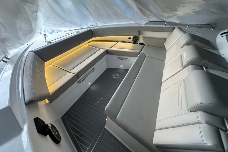 Slide: The Image of 2024 Cruisers Yachts 38 GLS OB interior with sleek seating and ambient lighting. - 10