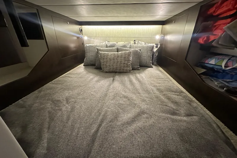 Slide: The Image of Luxurious cabin interior of 2024 Cruisers Yachts 38 GLS OB with plush bedding. - 17