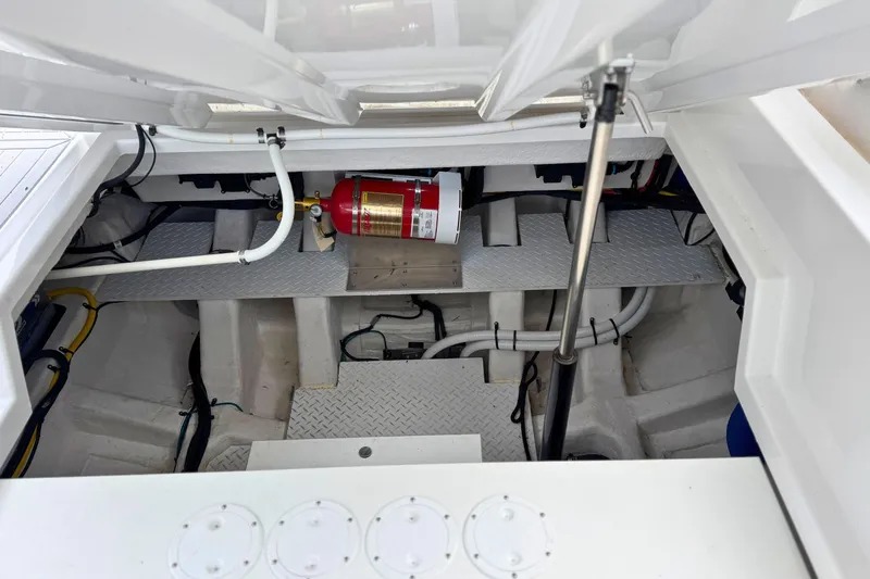 Slide: The Image of Engine compartment of 2024 Cruisers Yachts 38 GLS OB with fire extinguisher and hydraulic systems. - 18