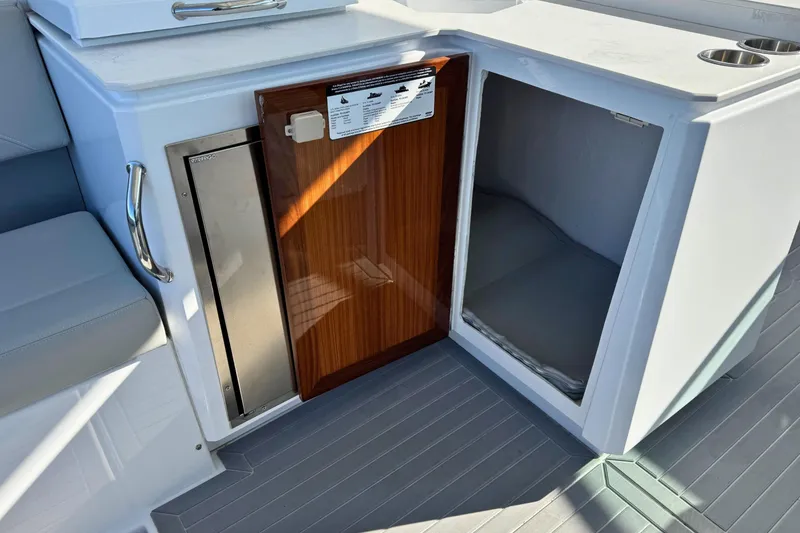 Slide: The Image of 2024 Cruisers Yachts 38 GLS OB interior with open storage and seating area. - 23