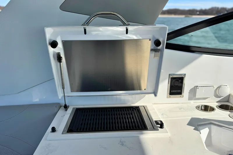Slide: The Image of Outdoor grill on 2024 Cruisers Yachts 38 GLS OB, featuring sleek design and functionality. - 24