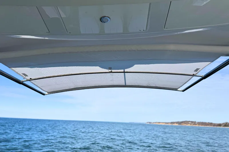 Slide: The Image of 2024 Cruisers Yachts 38 GLS OB canopy view over ocean. - 26