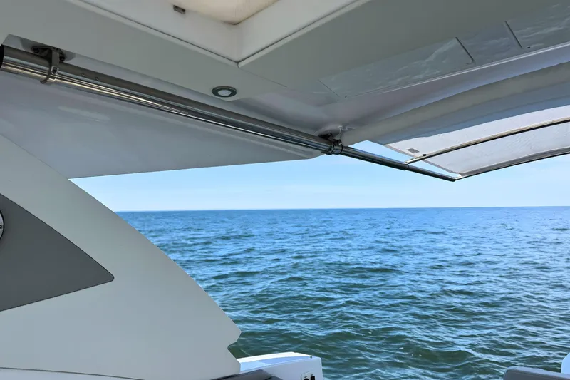 Slide: The Image of 2024 Cruisers Yachts 38 GLS OB, ocean view from yacht deck. - 27