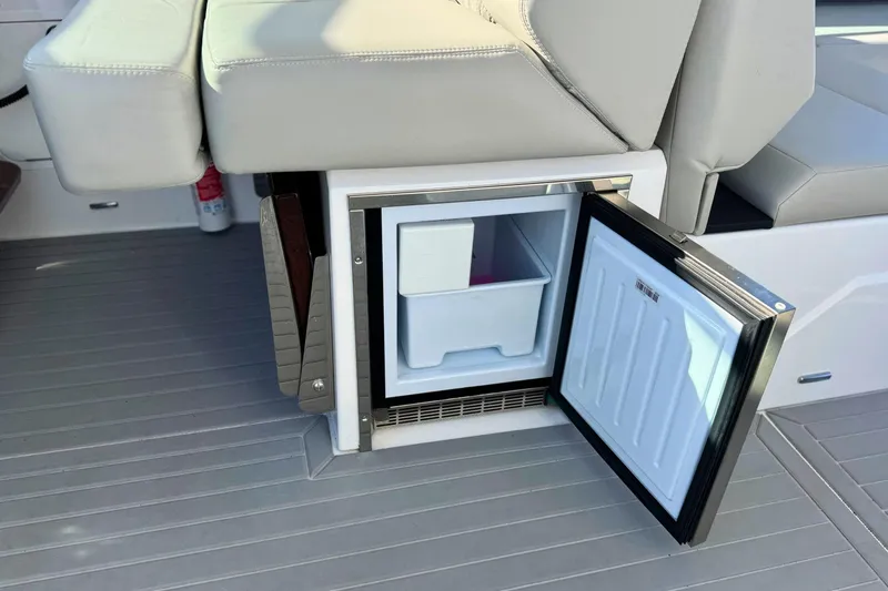 Slide: The Image of 2024 Cruisers Yachts 38 GLS OB with open onboard mini fridge. - 35