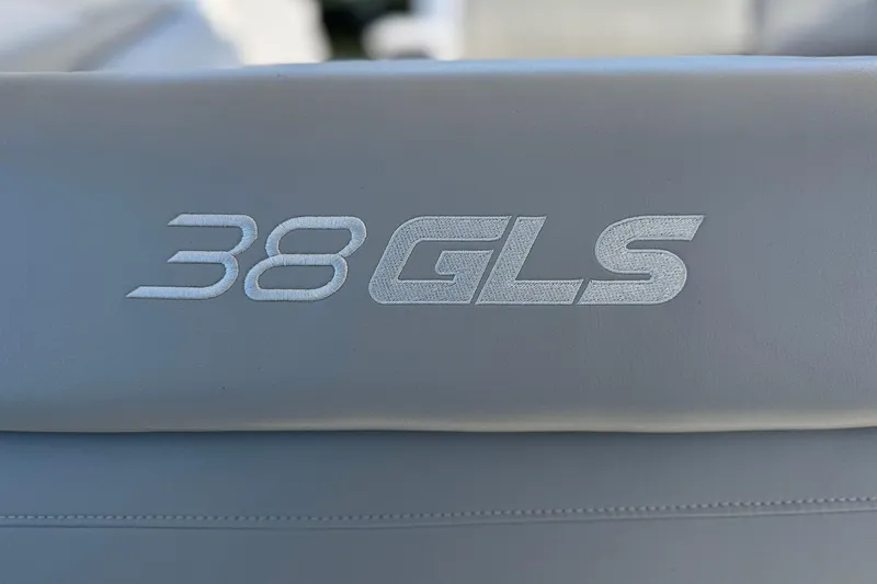 Slide: The Image of 2024 Cruisers Yachts 38 GLS OB logo on gray upholstery. - 36