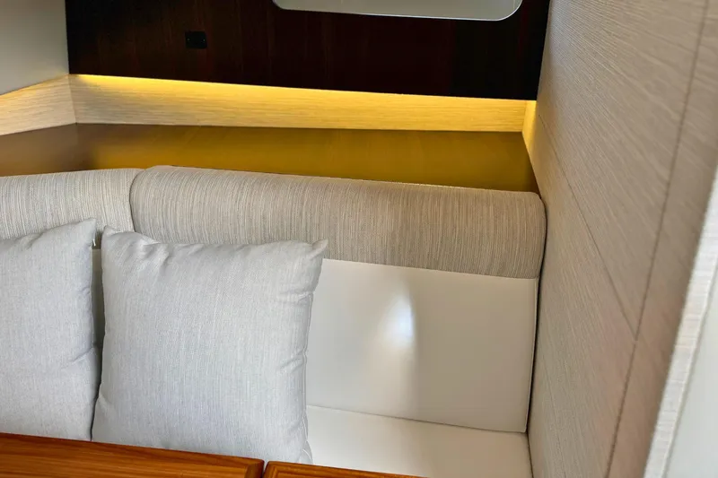 Slide: The Image of Luxurious interior seating of 2024 Cruisers Yachts 38 GLS OB with elegant cushions. - 50