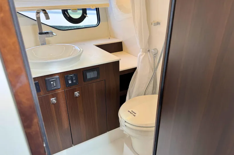 Slide: The Image of Luxurious bathroom interior of 2024 Cruisers Yachts 38 GLS OB with modern fixtures. - 53