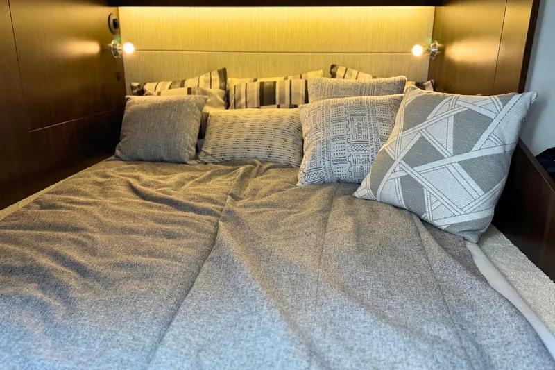 Slide: The Image of Cozy bed with patterned pillows in 2024 Cruisers Yachts 38 GLS OB cabin. - 54