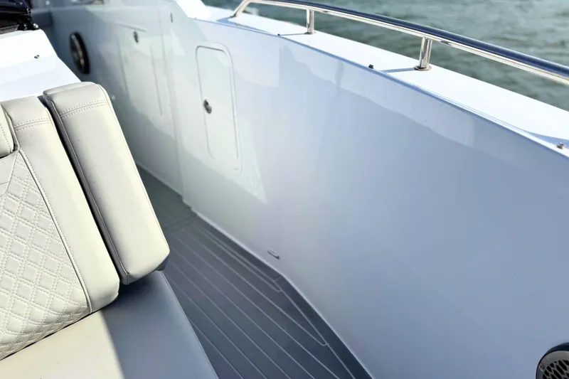 Slide: The Image of 2024 Cruisers Yachts 38 GLS OB interior with sleek seating and modern design. - 58