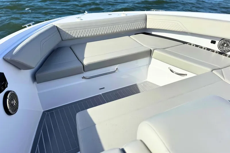 Slide: The Image of Luxurious seating area on 2024 Cruisers Yachts 38 GLS OB, featuring elegant gray upholstery. - 59