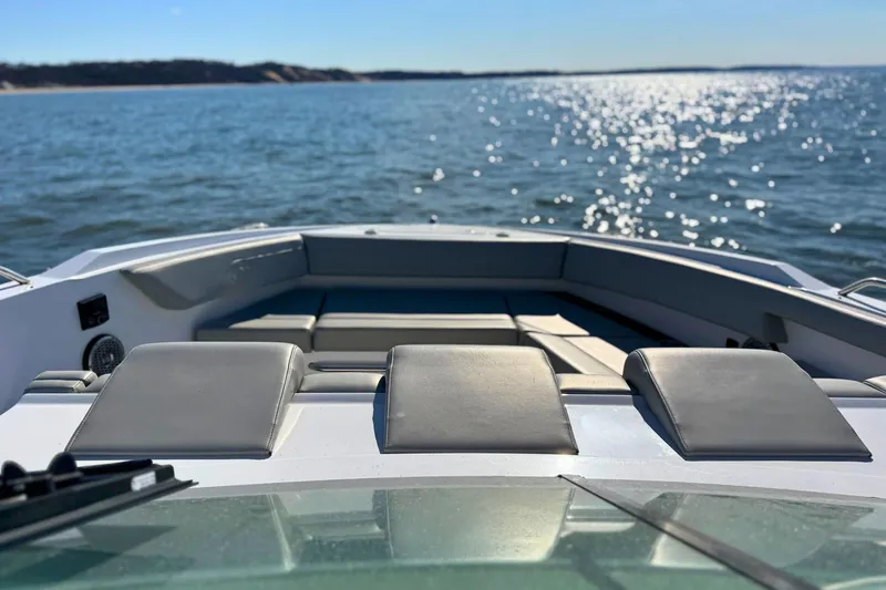 Slide: The Image of 2024 Cruisers Yachts 38 GLS OB on water, featuring luxurious seating and scenic view. - 63