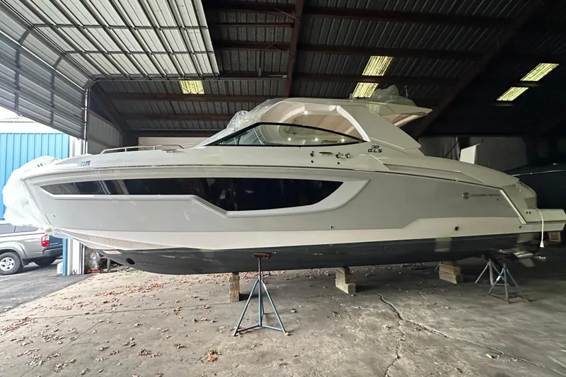 The Image of 2024 Cruisers Yachts 38 GLS OB in a covered storage area. - 0